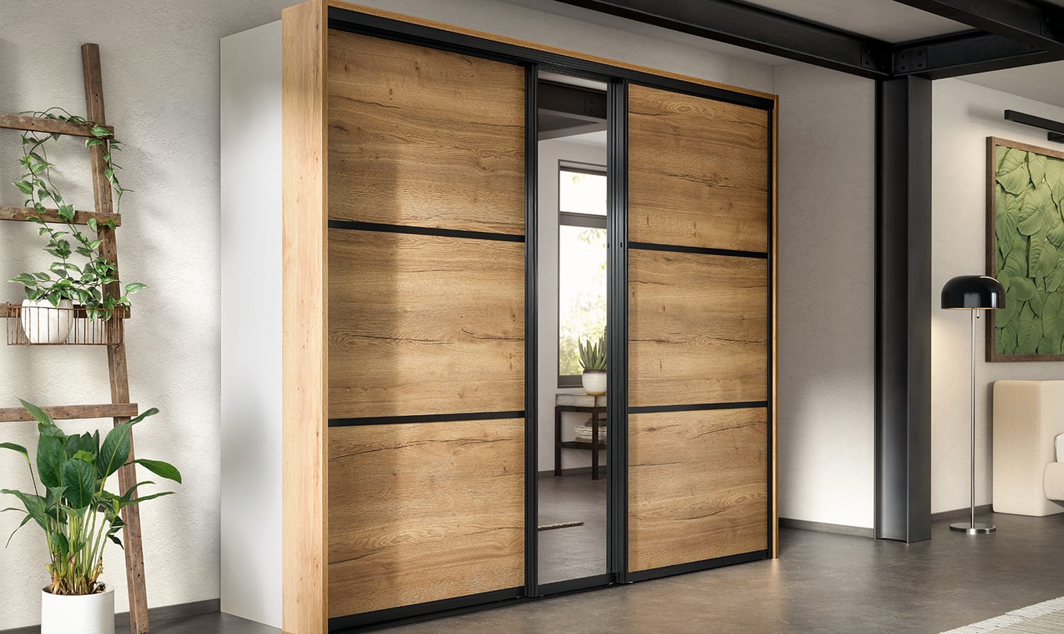 Grande armoire à portes coulissantes en décor chêne et miroir, ouverte sur une chambre attenante